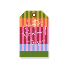 Load image into Gallery viewer, Cabana Club gift tag in multi-stripe with "Another trip around thesun" printed on textured paper