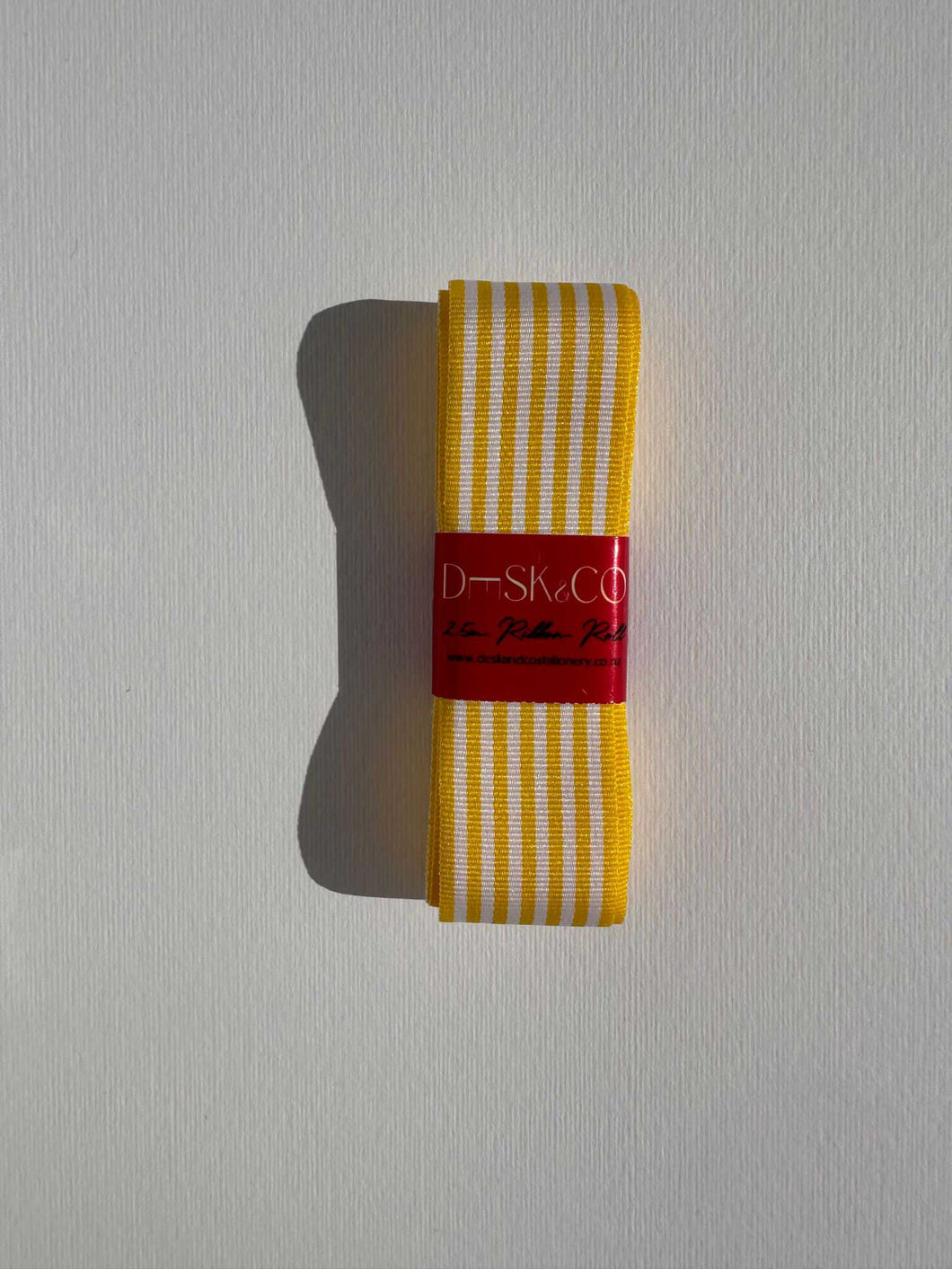 Striped grosgrain premium ribbon roll with white and bright yellow stripes. Add a pop of colour and style to elevate your gift wrapping.  